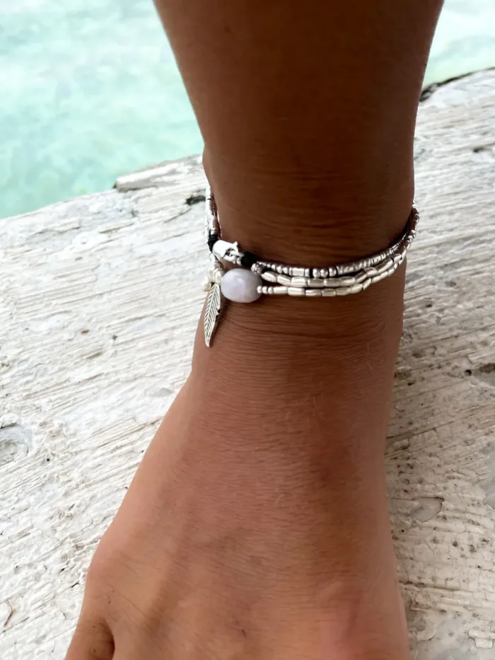 ocean inspired silver jewellery. Pure silver wrap bracelet with silver feather charm and kunzite gemstone - for a beach vibes look- water safe for everyday wear. 3 styles in 1