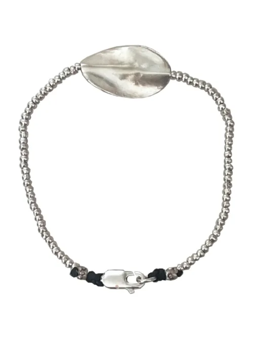 pure silver bracelet with warped disc. tug proof - perfect for active mums. ocean safe