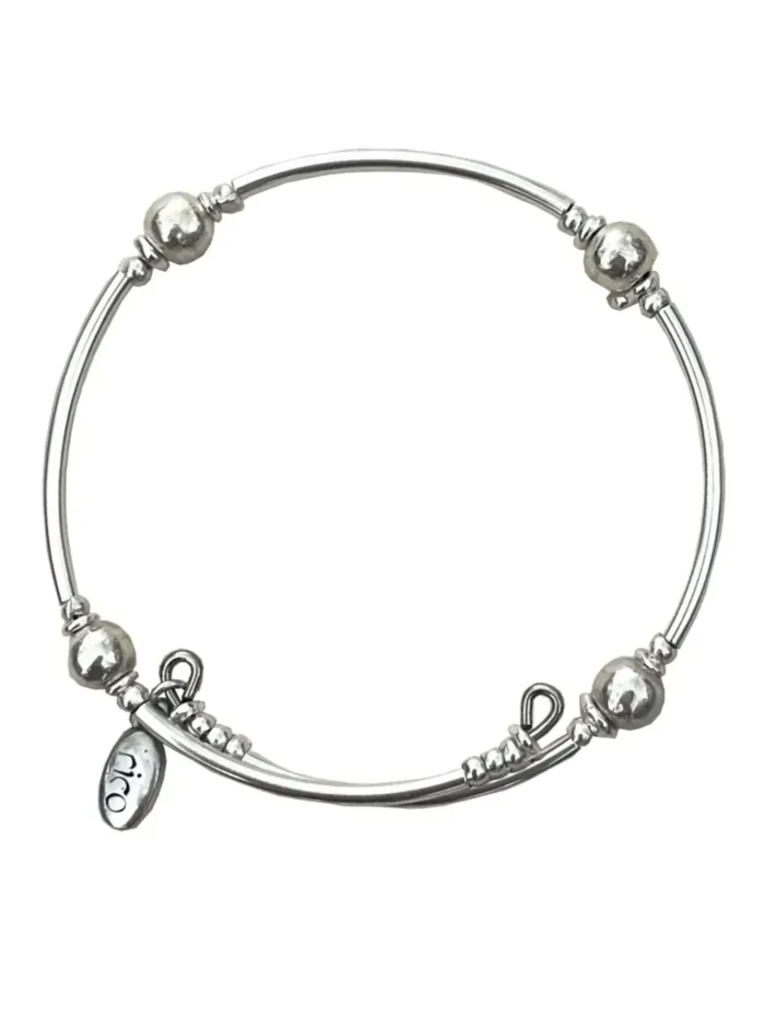 pure silver memory wrap bracelet perfect two add texture to a bracelet stack. small silver balls with sterling silver curve tubes. minimal style bracelet