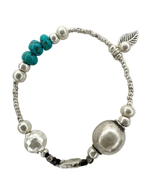 pure silver bracelet with turquoise gemstones. the perfect addition to add texture to your bracelet stack. ocean safe silver jewelry