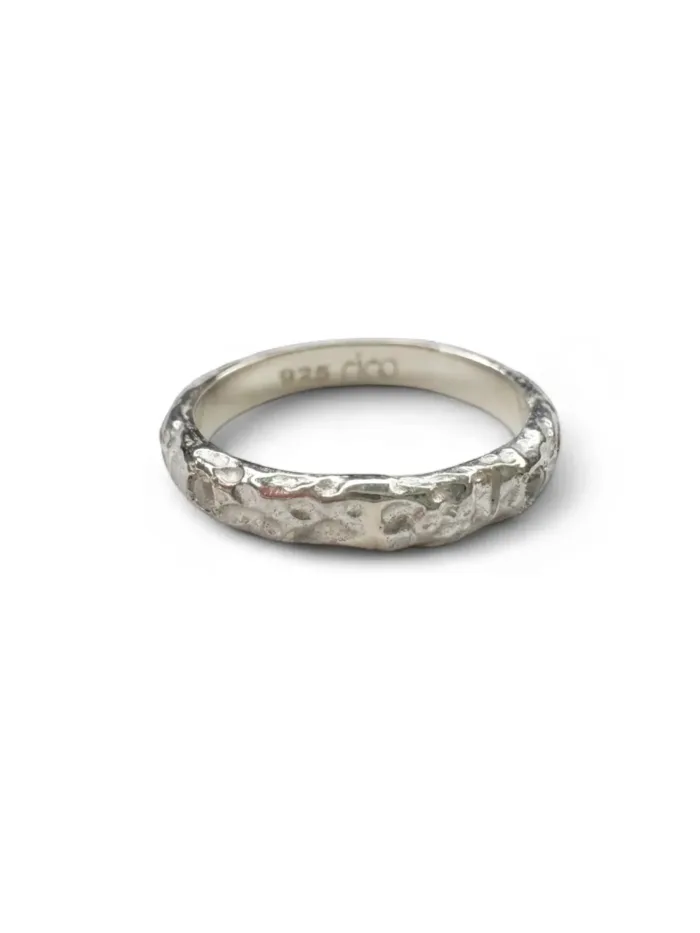 sterling silver ring with molten texture and cubic zircon. ocean safe, great for stacking