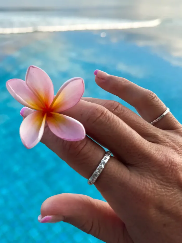 sterling silver ring with molten texture and cubic zircon. ocean safe, great for stacking
