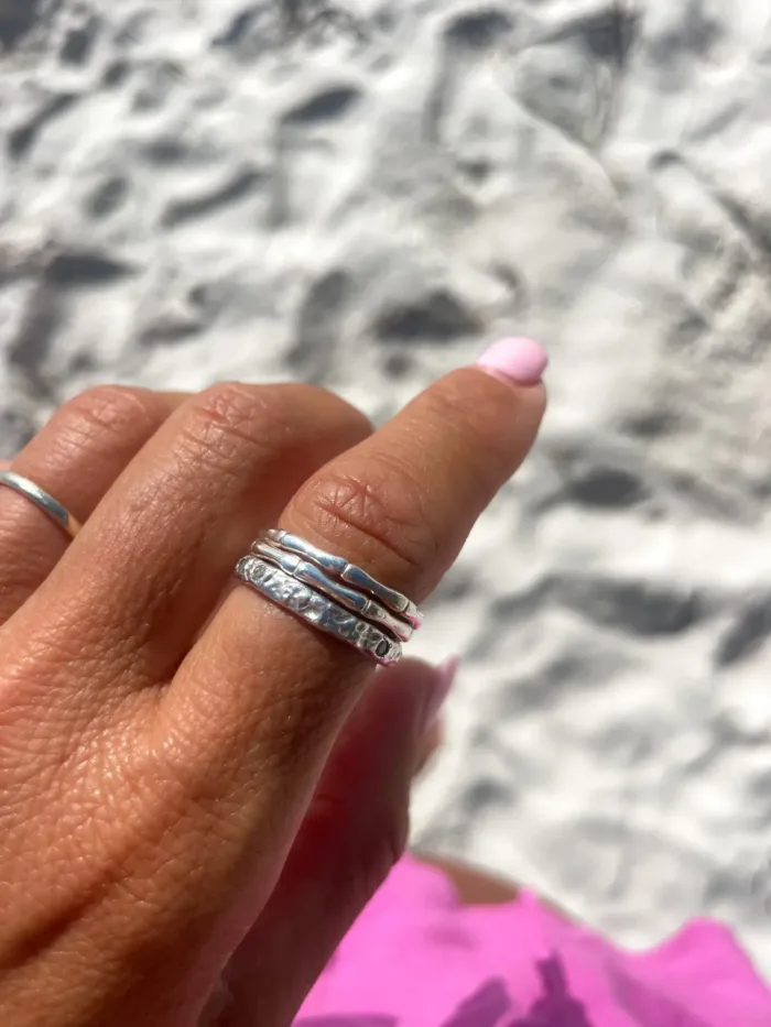 sterling silver ring with molten texture and cubic zircon. ocean safe, great for stacking