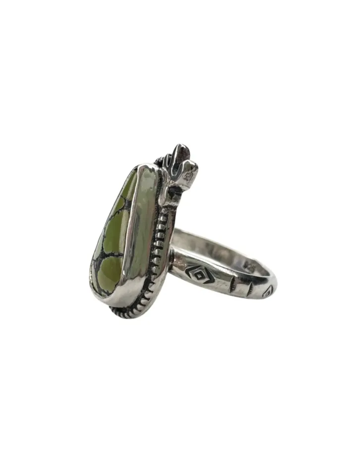 handmade sterling silver ring with genuine turquoise. Green in colour with black veining. Accented with a small handout sterling silver cactus. Unique one of a kind ring