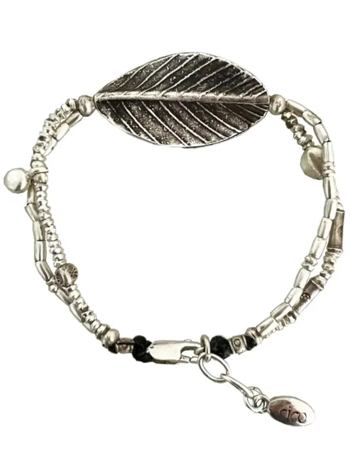 pure silver bracelet with large leaf centre. the perfect addition to add texture to your bracelet stack. ocean safe silver jewelry