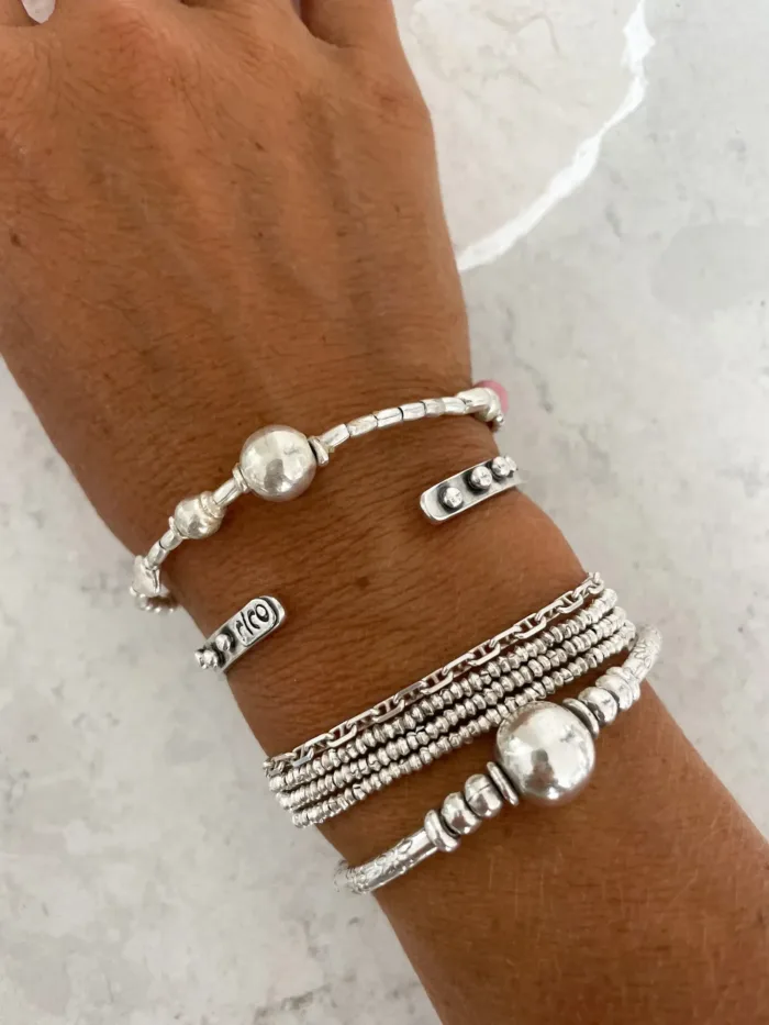 pure silver bracelet with ball bead centre and glass bead pink colour pop. ocean safe silver jewelry