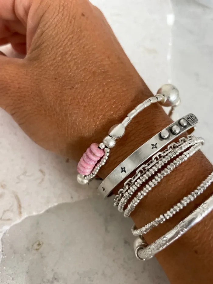 pure silver bracelet with ball bead centre and glass bead pink colour pop. ocean safe silver jewelry