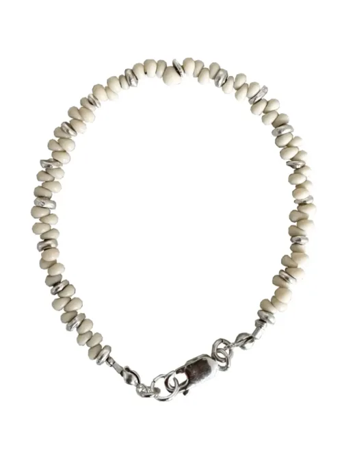 Handmade pure silver bracelet featuring coconut colour seed beads – a great minimal bracelet to add texture and style to your bracelet stack