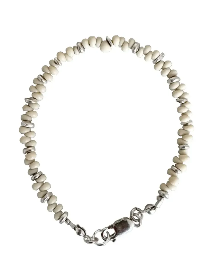 Handmade pure silver bracelet featuring coconut colour seed beads – a great minimal bracelet to add texture and style to your bracelet stack