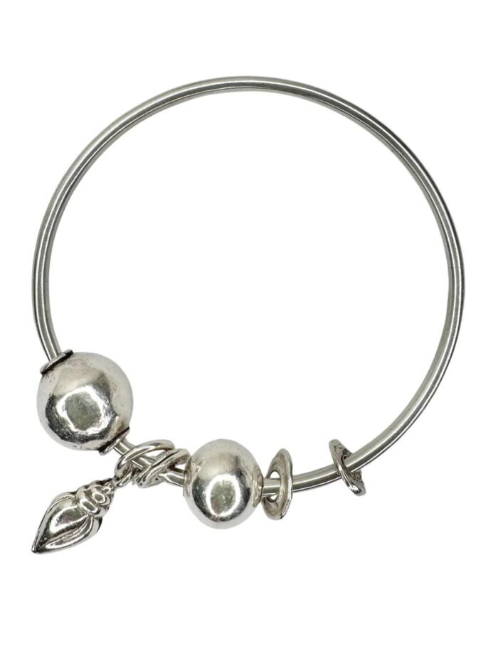 sterling silver bangle with pure silver ball beads and shell charm tassel. Handmade and ocean inspired. ocean safe and perfect to wear everyday