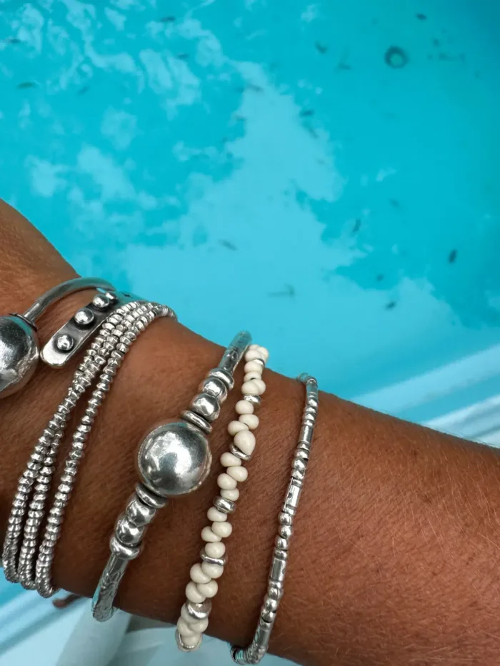 Handmade pure silver bracelet featuring coconut colour seed beads – a great minimal bracelet to add texture and style to your bracelet stack