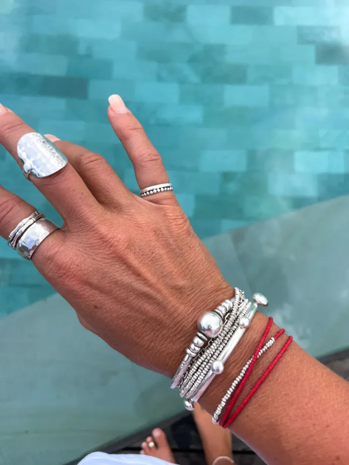 Handmade pure silver wrap bracelet featuring red colour seed beads – a great minimal wrap bracelet style for everyday wear
