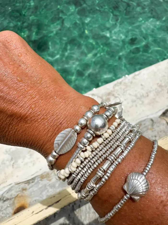 Handmade pure silver bracelet featuring coconut colour seed beads – a great minimal bracelet to add texture and style to your bracelet stack