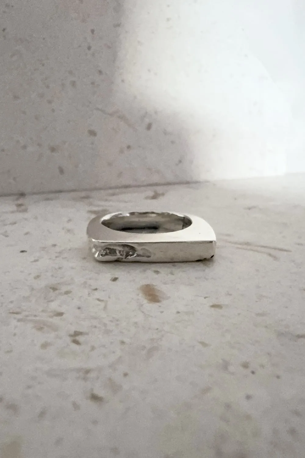 silver signet ring with eroded edge. handmade ring