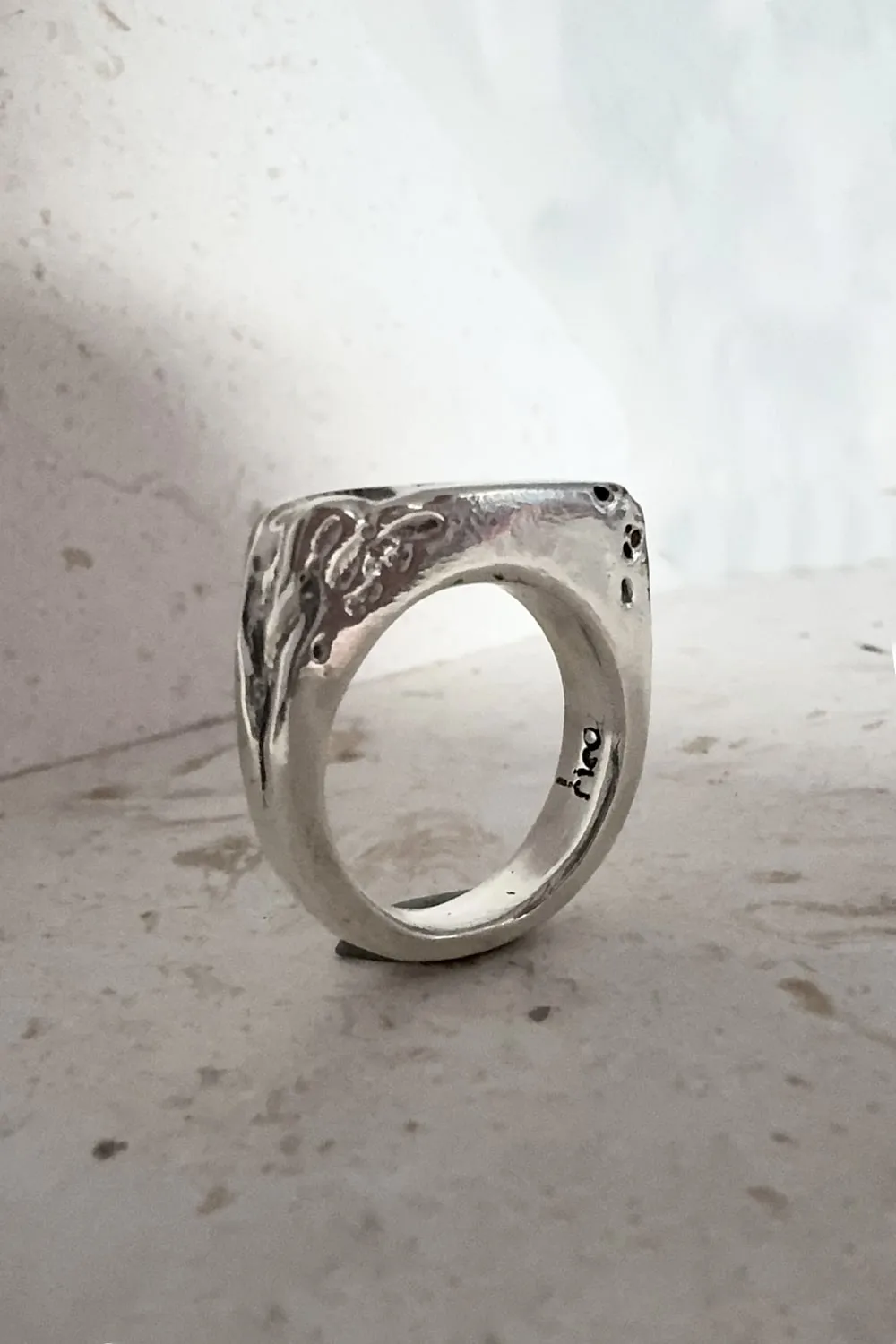 silver signet ring with eroded edge. handmade ring
