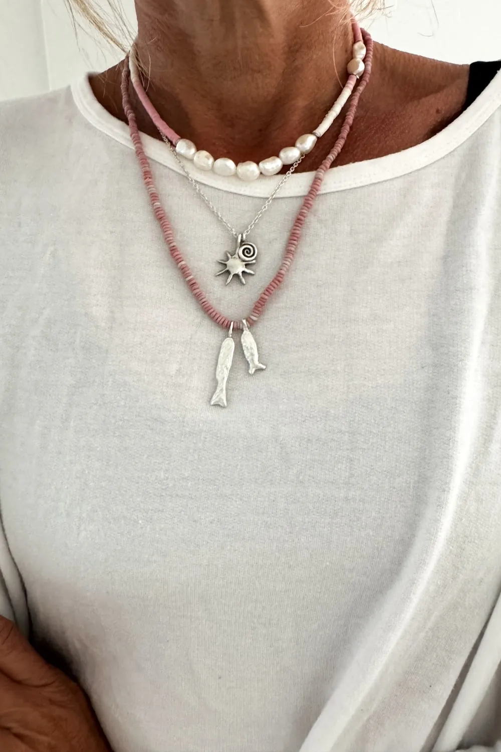 with spiral pendant on a sterling silver chain necklace