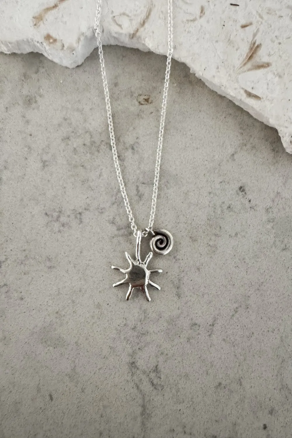with spiral pendant on a sterling silver chain necklace