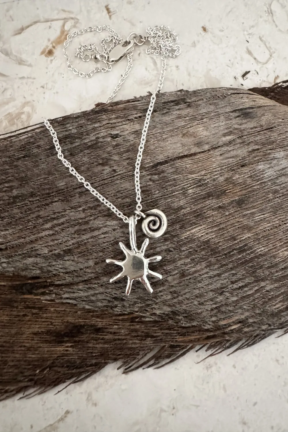 with spiral pendant on a sterling silver chain necklace