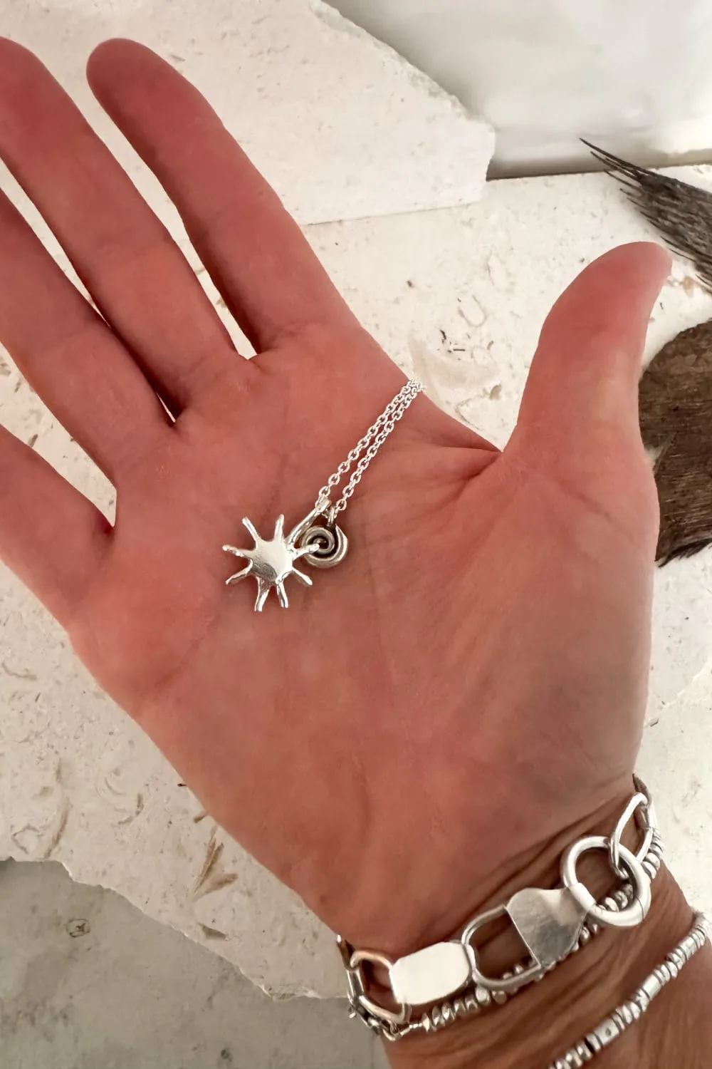 with spiral pendant on a sterling silver chain necklace