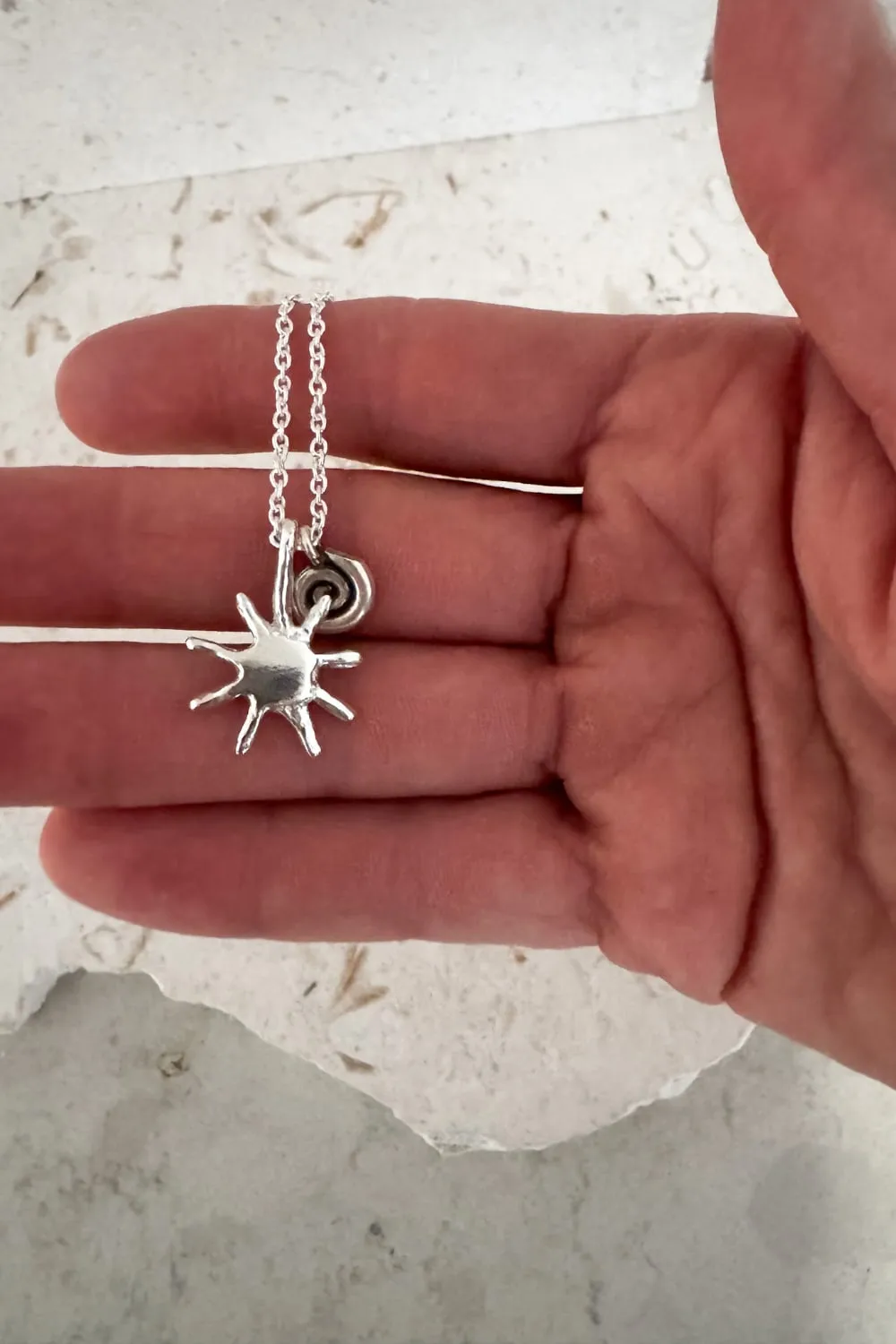 with spiral pendant on a sterling silver chain necklace