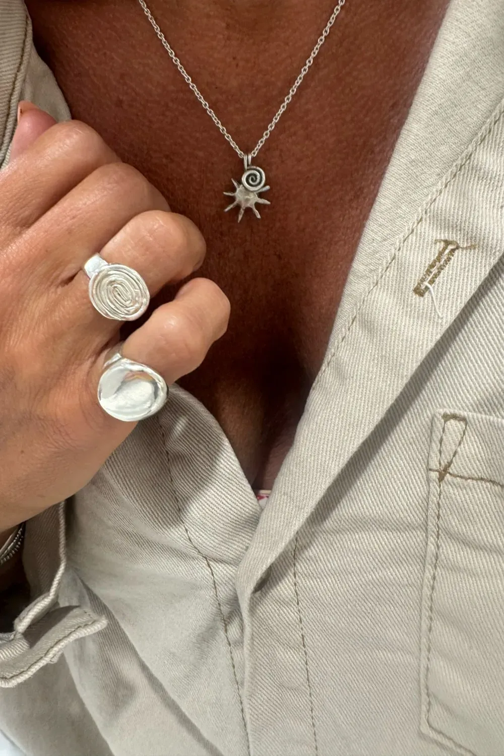 with spiral pendant on a sterling silver chain necklace