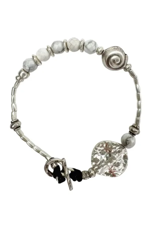 beach inspired pure silver bracelet with spiral silver shell and faceted white agate gemstones. Looks great worn solo or in a bracelet stack. Ocean safe