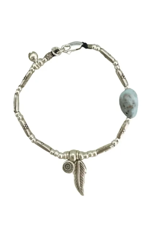pure silver bracelet with silver feather charm and Larimar gemstone nugget. Wear everyday jewellery staple. Ocean safe.