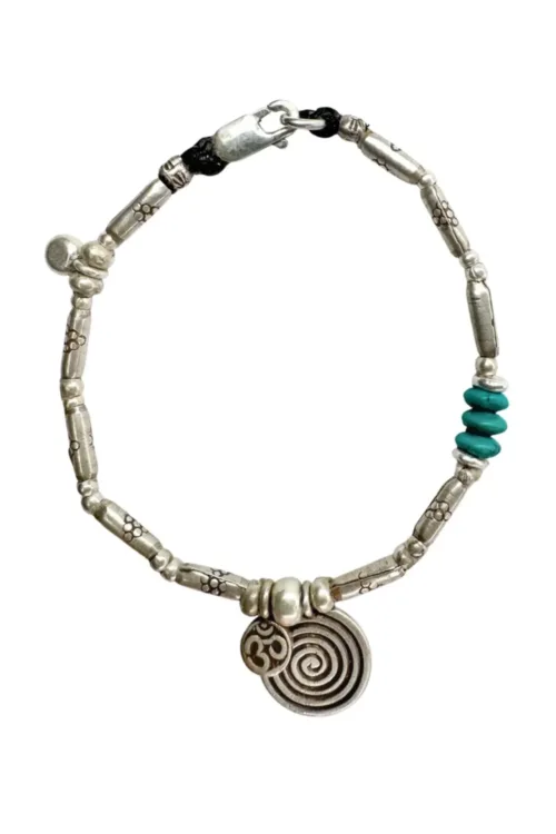pure silver women's bracelet with spiral pendant and om charm. Perfect to wear everyday. Ocean safe and tub proof for active mums.