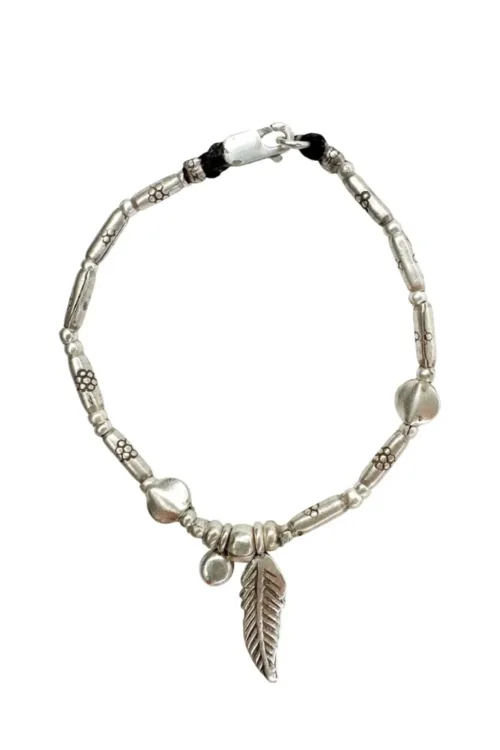 pure silver bracelet boho inspired. feather pendant perfect for everyday wear. ocean safe.