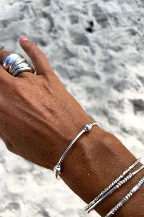 pure silver memory wrap bracelet perfect two add texture to a bracelet stack. small silver balls with sterling silver curve tubes. minimal style bracelet