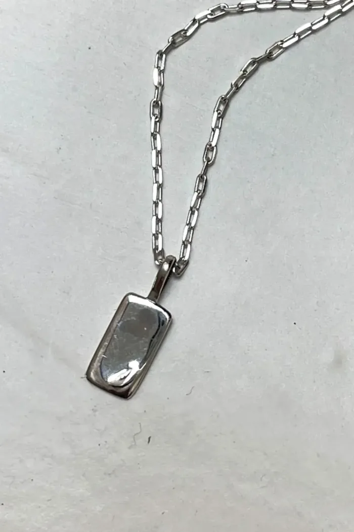 petite sterling silver rectangle pendant with moon detail on sterling silver chain. Dainty necklace. ocean safe