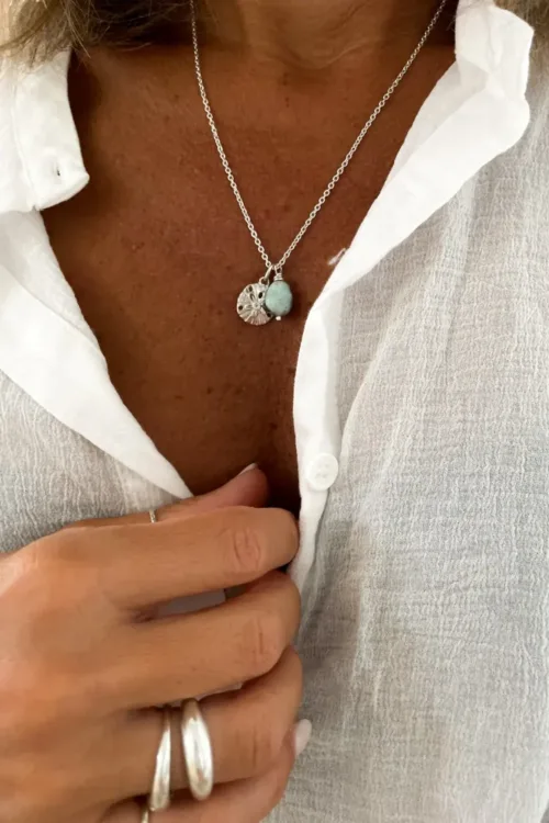 sterling silver necklace with silver sand dollar pendant and Larimar nugget. Handmade in Sydney, Australia. Ocean safe