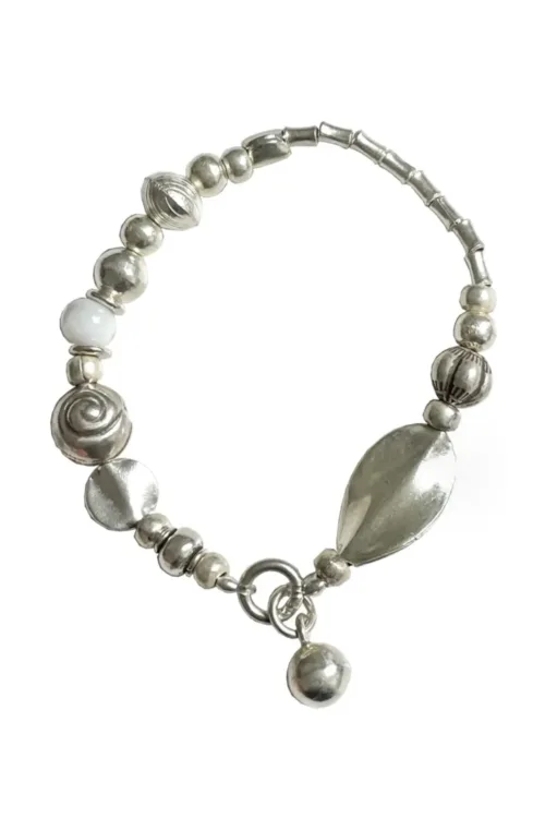 pure silver strong stretch elastic bracelet with white lamp work beads. Easy to slip on and off. Water safe