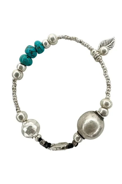 pure silver bracelet with turquoise gemstones. the perfect addition to add texture to your bracelet stack. ocean safe silver jewelry