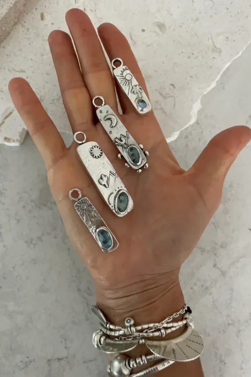 handmade one of a kind hollow form rectangle pendant with kyanite gemstone and hand stamped sun ocean safe