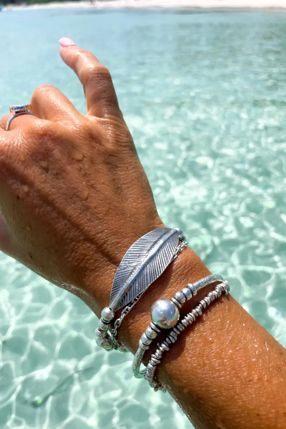 chunky pure silver bracelet perfect for stacking. large curve leaf for bohemian style. easy to slip on stretch elastic curve leaf bracelet