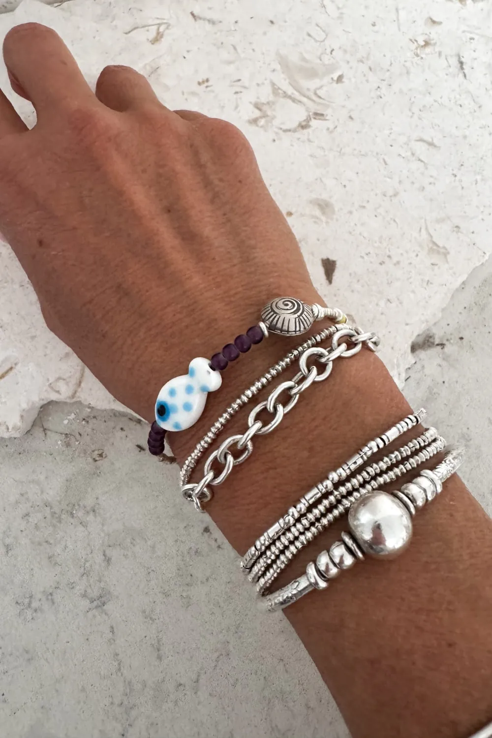 ocean inspired silver bracelet with white glass fish and silver shell