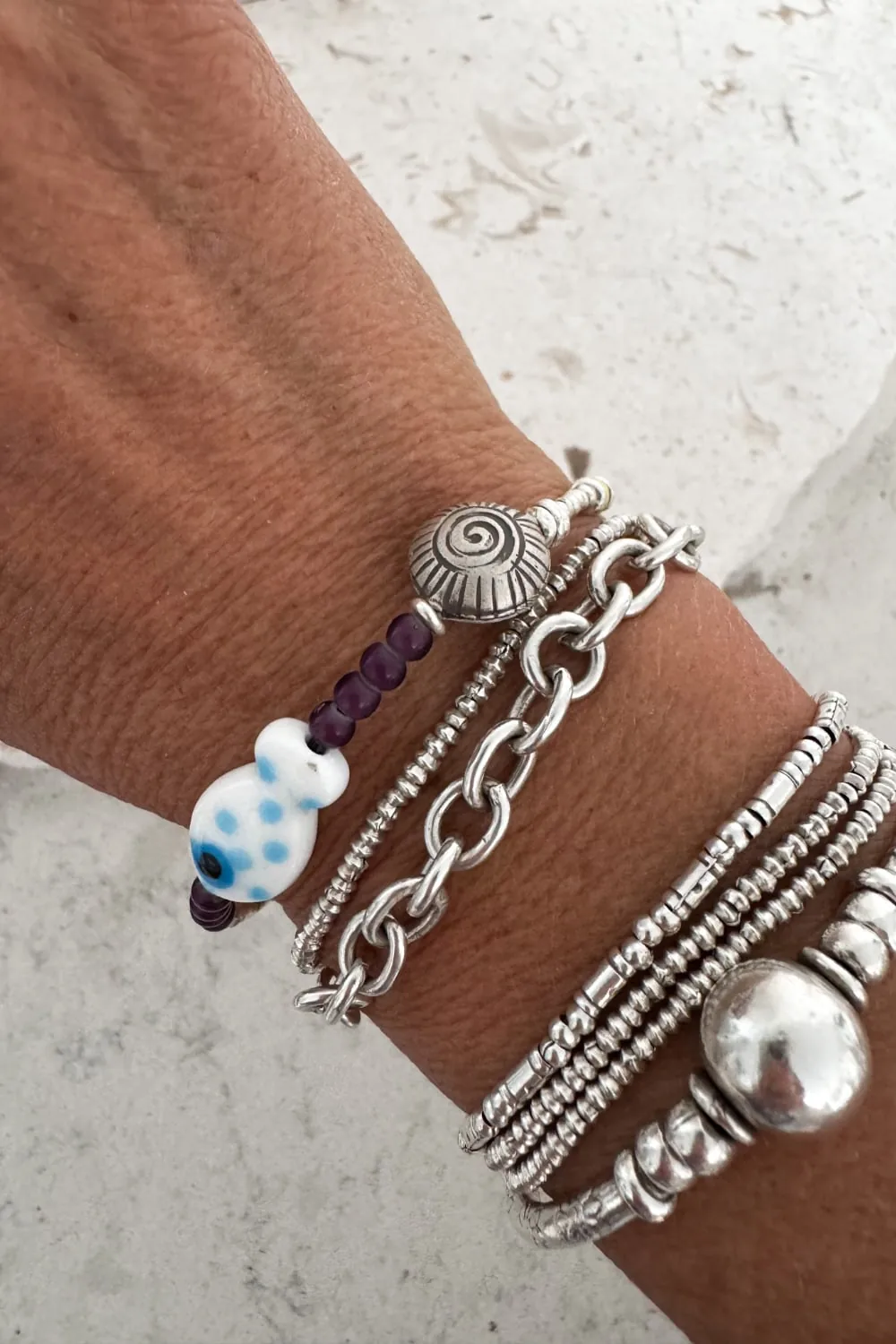 ocean inspired silver bracelet with white glass fish