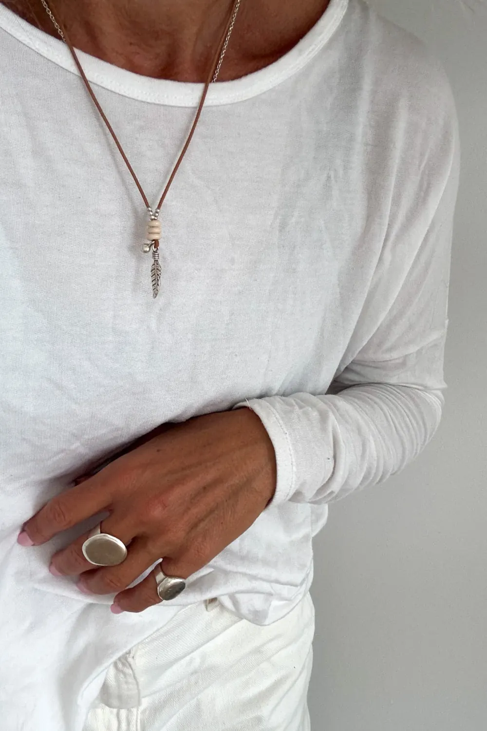 handmade silver leather necklace with silver feather charm bohemian style